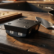 Black HONE Knife Holder showing its 15-degree side beside a chef's knife