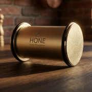Close-up of the HONE rolling sharpener with a circular sharpening disc facing forward