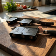 HONE Extension shown attached and detached from a HONE Knife Holder beside two kitchen knives