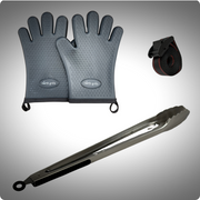 Pair of grey grilling gloves, black buckle strap and long metal tongs