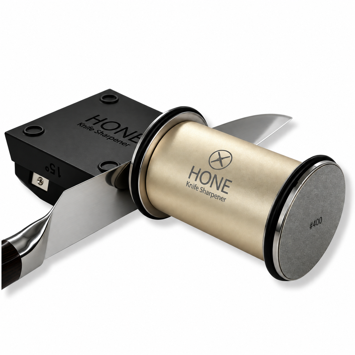 Real HONE gold rolling knife sharpener beside a kitchen knife supported by the magnetic knife holder