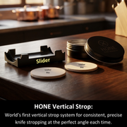 Black HONE Vertical Strop stand, two round leather discs and storage case on a kitchen counter