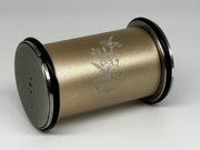 Close-up of a HONE sharpener roller engraved with flowers and a butterfly