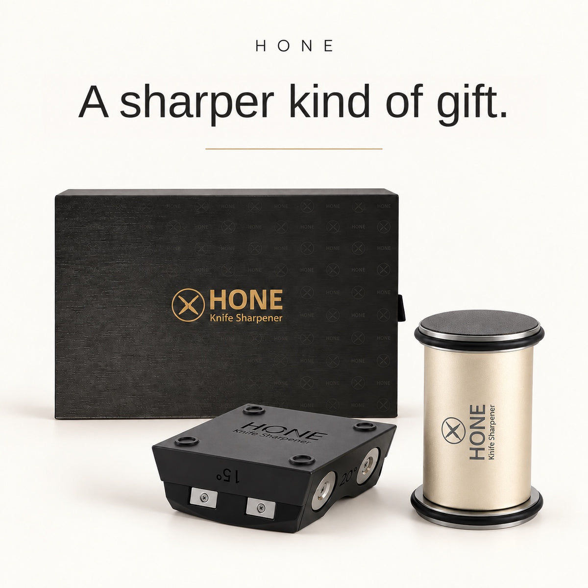 HONE Knife Sharpener kit with knife holder, roller and presentation box on an ivory background