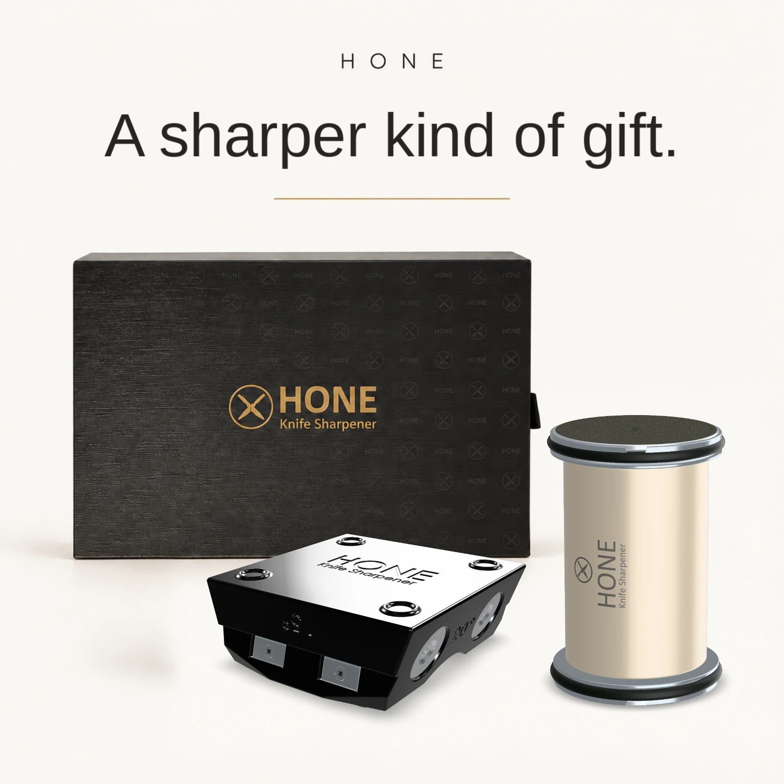 HONE Knife Sharpener, magnetic knife holder, and presentation gift box on a warm ivory background