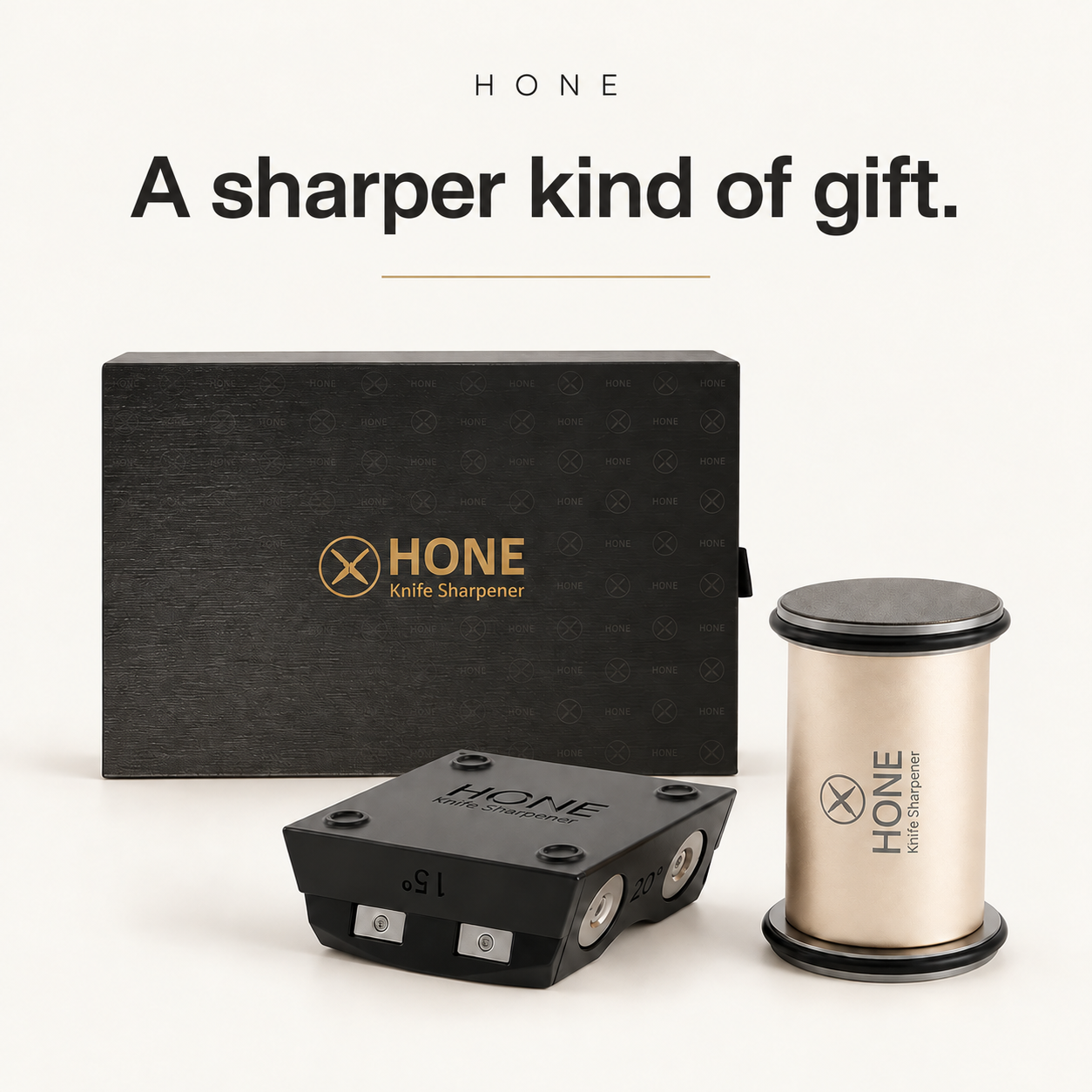 HONE Knife Sharpener, magnetic knife holder, and presentation gift box on a warm ivory background