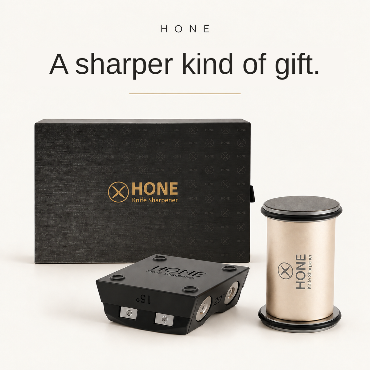 HONE Knife Sharpener, magnetic knife holder, and presentation gift box on a warm ivory background